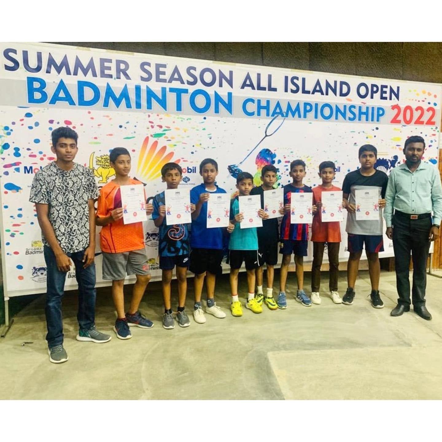Benhill College badminton champions with their certificates